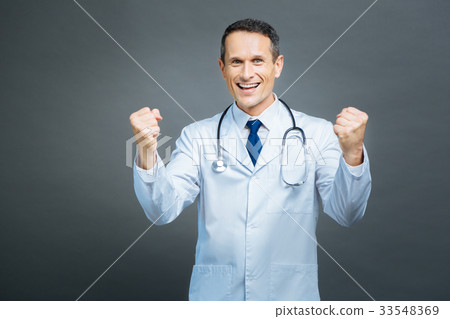 Extremely happy medical professional showing 33548369