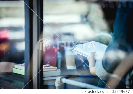 teenage hipster alone at cafe with notebook teenage hipster alone at cafe with notebook 33549627