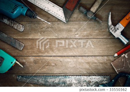 grunge tools on wooden background with empty space 33550362