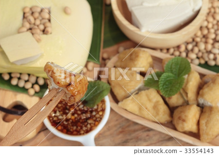 Fried tofu, chinese vegetarian food with sauce. 33554143