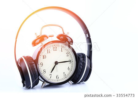 Retro black alarm clock with headphone  isolated 33554773