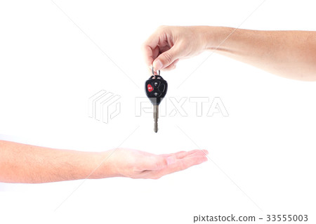 Man hand holding car keys exchange isolated 33555003