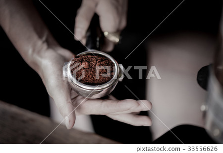 Coffee powder in espresso scoop, Focused at scoop Coffee powder in espresso scoop, Focused at scoop 33556626