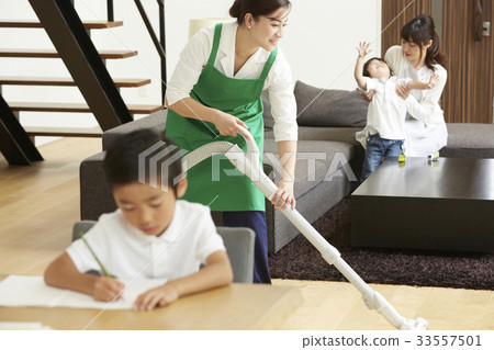 Housekeeper and family relaxing Housekeeper and family relaxing 33557501
