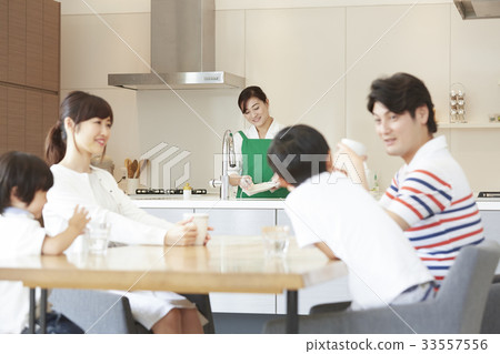 Housekeeper and family relaxing 33557556