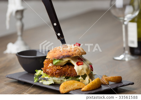 home made tasty chicken burgers on wooden table home made tasty chicken burgers on wooden table 33561588