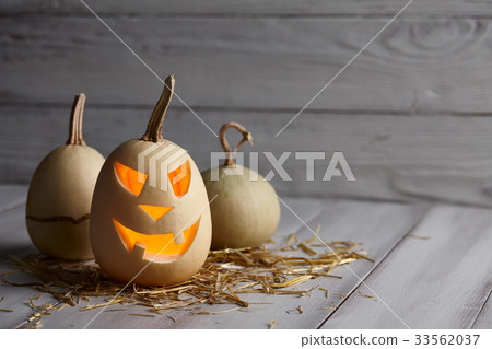 Scary halloween pumpkins in old barn Scary halloween pumpkins in old barn 33562037