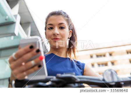 Business woman with a smart phone 33569648