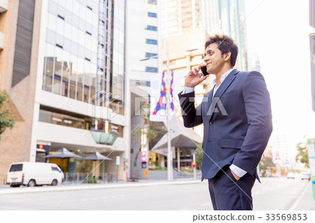 Portrait of confident businessman outdoors 33569853