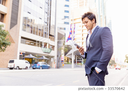 Portrait of confident businessman outdoors 33570642