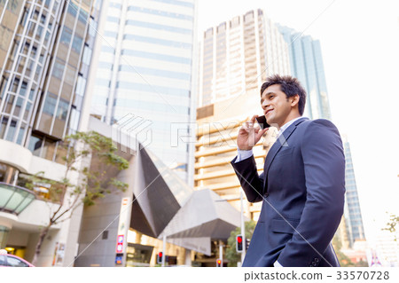 Portrait of confident businessman outdoors 33570728