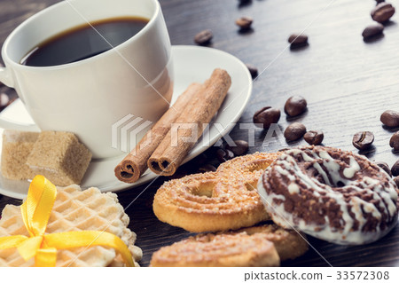 Biscuits and coffee on table Biscuits and coffee on table 33572308