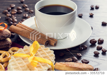 Biscuits and coffee on table 33572710