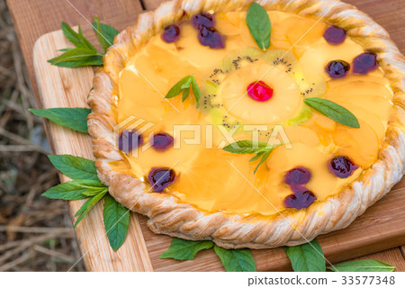 Fruit pizza with pineapple, orange, kiwi, cherry Fruit pizza with pineapple, orange, kiwi, cherry 33577348