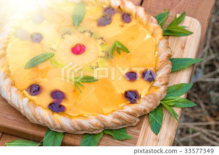 Fruit pizza with pineapple, orange, kiwi, cherry Fruit pizza with pineapple, orange, kiwi, cherry 33577349