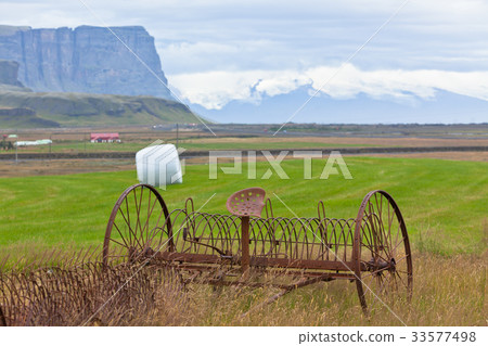 Rusty plows on a field of Iceland 33577498
