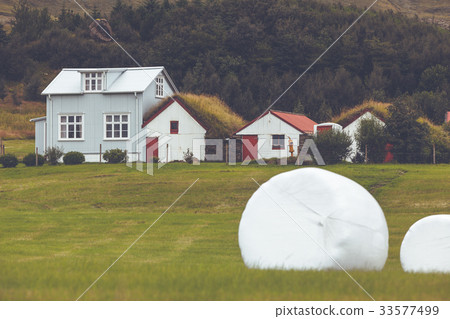 White Hay Rolls on a Green Field of Iceland 33577499