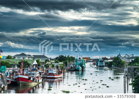 Many fishing boats docked in the canal. Many fishing boats docked in the canal. 33579308