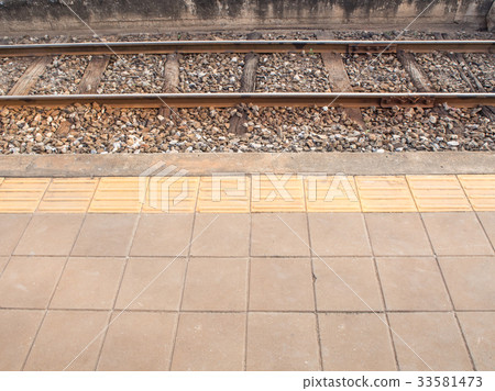 pavement and braille block of platform 33581473