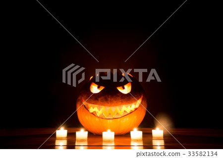Candlelight halloween pumpkin with fire eyes mouth 33582134