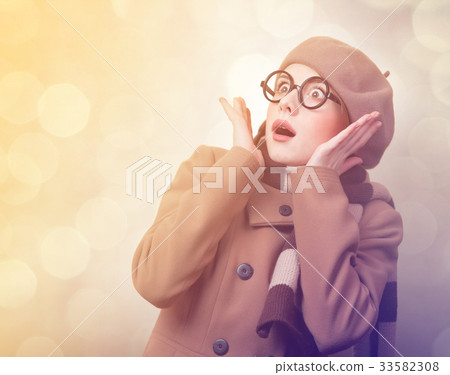 Redhead girl in coat and scarf Redhead girl in coat and scarf 33582308