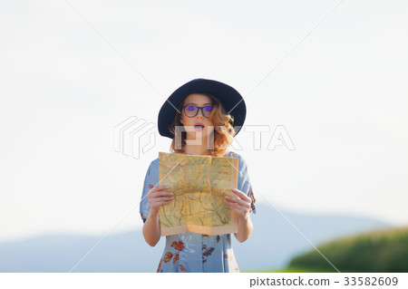 young woman in dress with map young woman in dress with map 33582609
