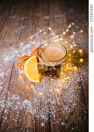 Creamy ginger coffee on the wooden table Christmas 33585495