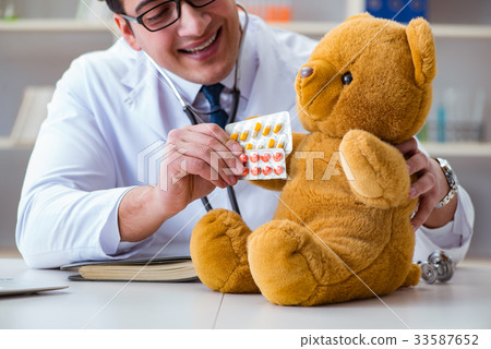 Doctor veterinary pediatrician holding an Doctor veterinary pediatrician holding an 33587652