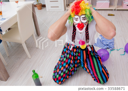 Drunk clown celebrating having a party at home 33588671