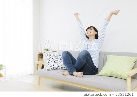 Young woman relaxing on the sofa 33591261