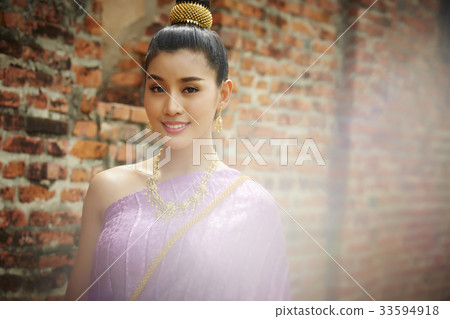 The photo of a beautiful woman smiling and looking at something. The photo of a beautiful woman smiling and looking at something. 33594918