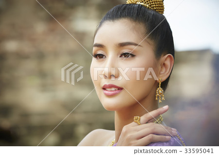 a portrait of beautiful young woman in thai costume 33595041
