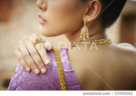 back view photo of thai woman looking at something 33595091