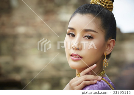 a portrait of beautiful thai woman looking at camera 33595115