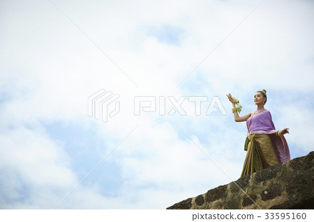 A picture of a Thai girl standing outdoors 33595160