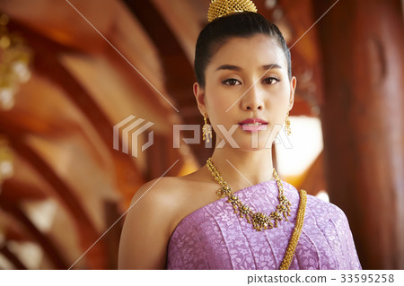 A photo of a beautiful Thai woman staring at the camera seriously. A photo of a beautiful Thai woman staring at the camera seriously. 33595258