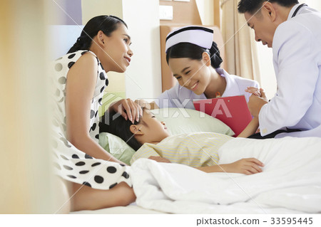 asian doctor and nurse are visiting patient after surgery 33595445