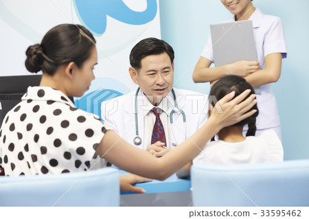 pediatrician is talking to girl and her mother in clinic pediatrician is talking to girl and her mother in clinic 33595462