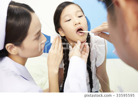 a picture of a young girl being checked by a dentist 33595595