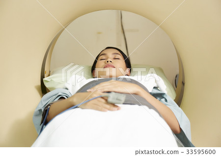 a photo of a woman lying and checking in the hospital a photo of a woman lying and checking in the hospital 33595600