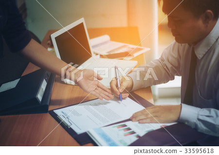 Clossup picture of a handsome businessman planning a laptop job 33595618