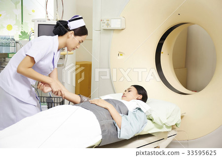 a picture of a nurse taking care of her patient in the hospital a picture of a nurse taking care of her patient in the hospital 33595625