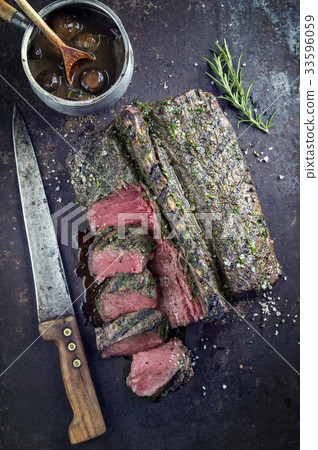 Barbecue Saddle of Venison on old Metal Sheet 33596059