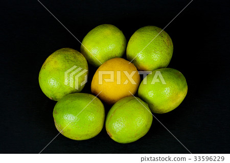lime in bamboo basket on black background. 33596229