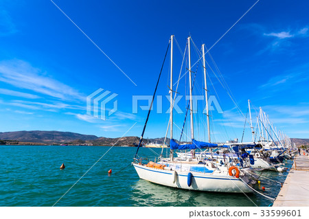 Sailing ships and yachts in port of Volos, Greece Sailing ships and yachts in port of Volos, Greece 33599601