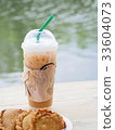 ice coffee with curry on wooden table. 33604073
