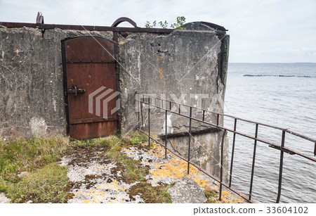 Rusted steel door, entrance to abandoned bunker Rusted steel door, entrance to abandoned bunker 33604102