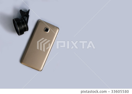 Clip lens with mobile phones in white background. 33605580