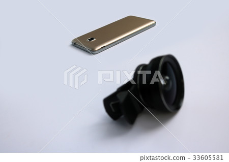 Clip lens with mobile phones in white background. Clip lens with mobile phones in white background. 33605581