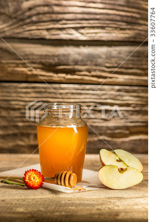 The bowl with honey on wooden table.The bank of The bowl with honey on wooden table.The bank of 33607764